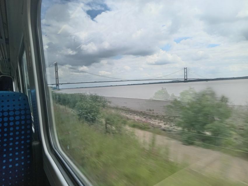 View of long bridge stretching across a body of water