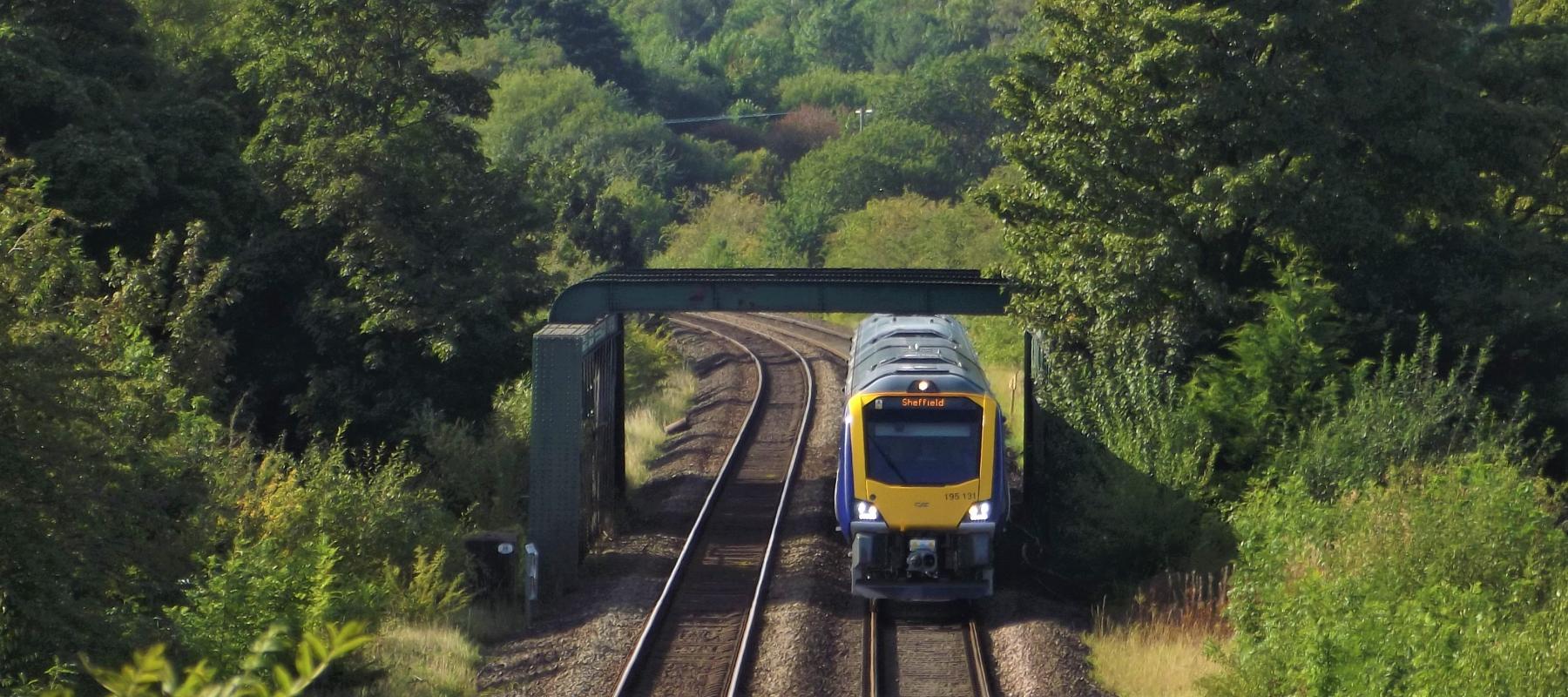 Train travelling through the stunning landscape of the Hope Valley Line