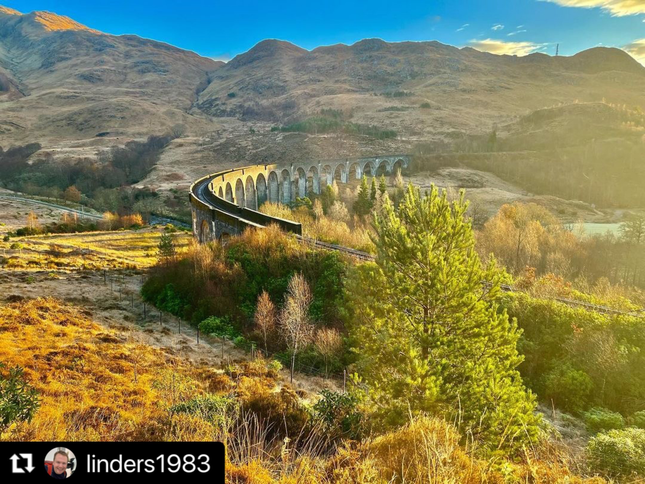 Curved viaduct famous for being in Harry Potter films with Scottish Highlands in background