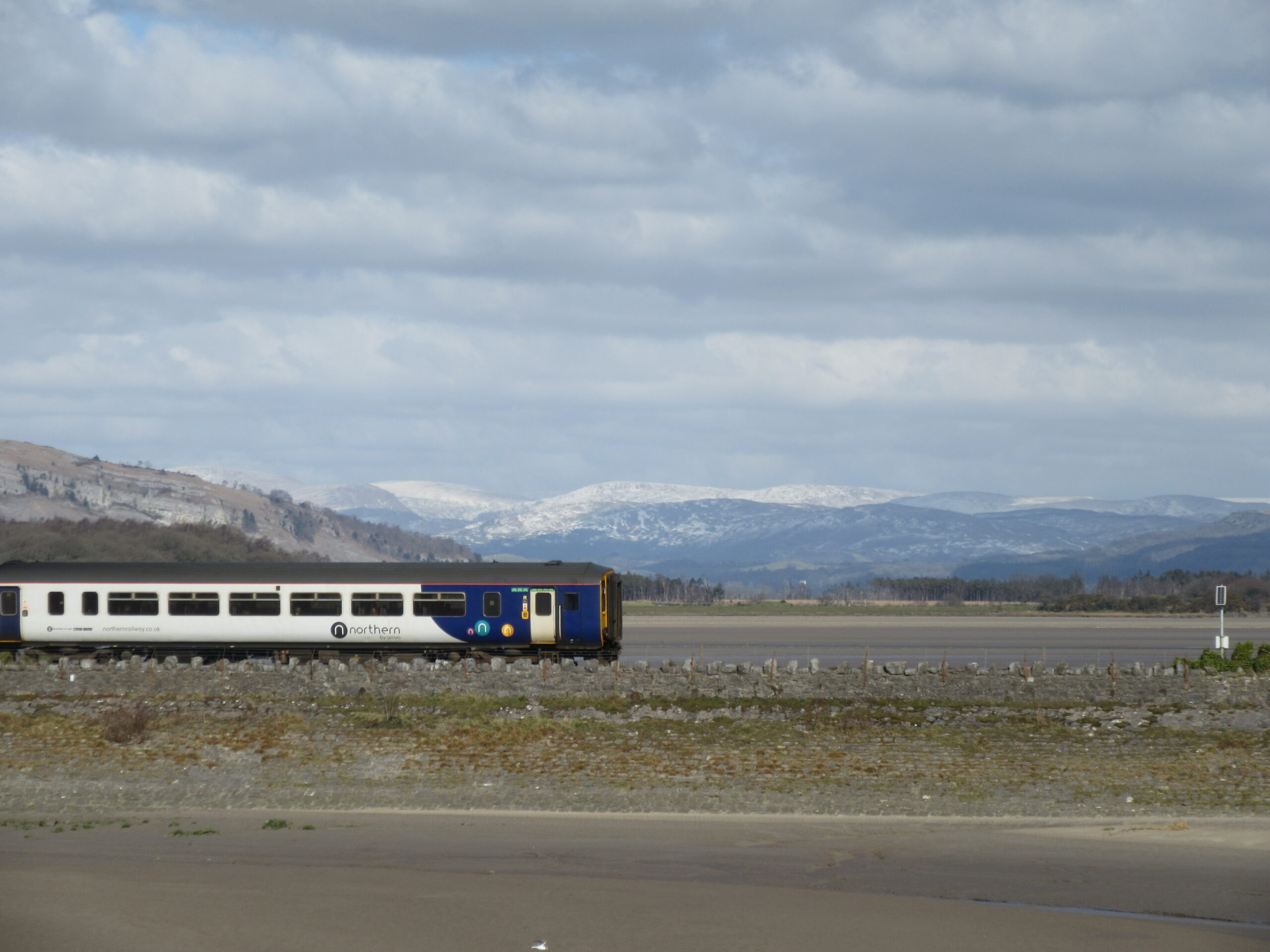 Bridge across Kent estuary with the Lake District mountains in the background. Taken at Arnside.