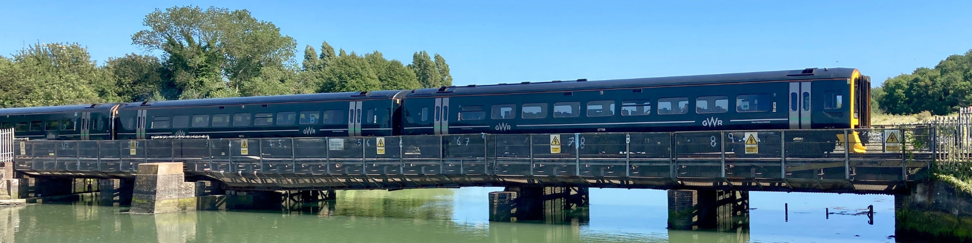 Train travelling over bridge leading onto Portsea Island