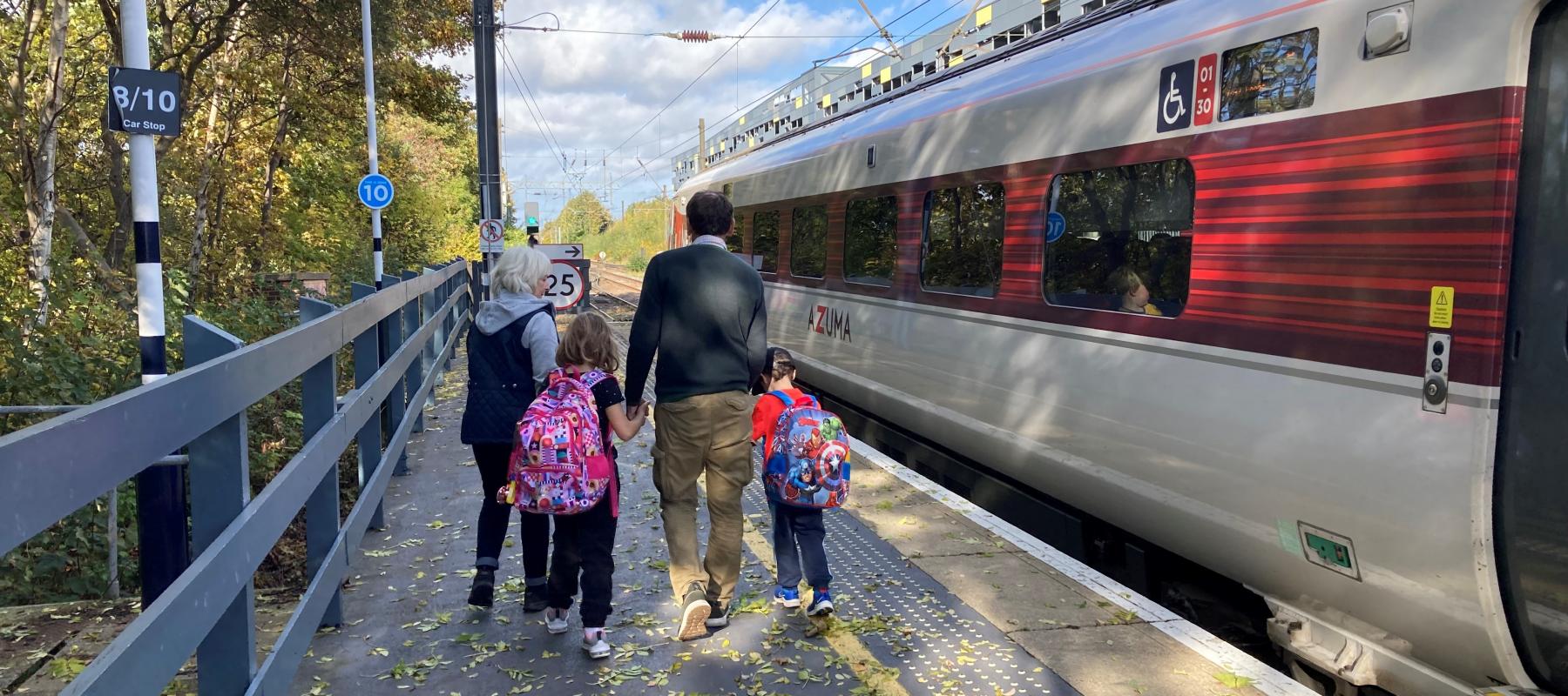 Family and train at platform