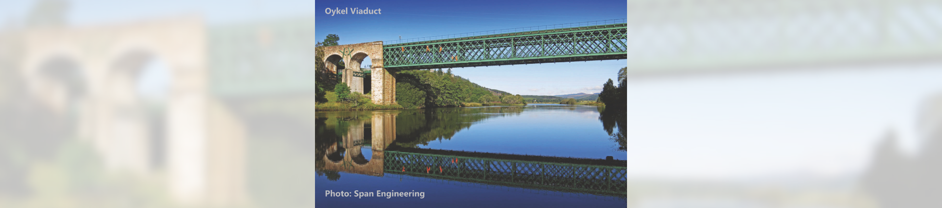 Far North Line - view of viaduct with reflect in water below on a blue sky day
