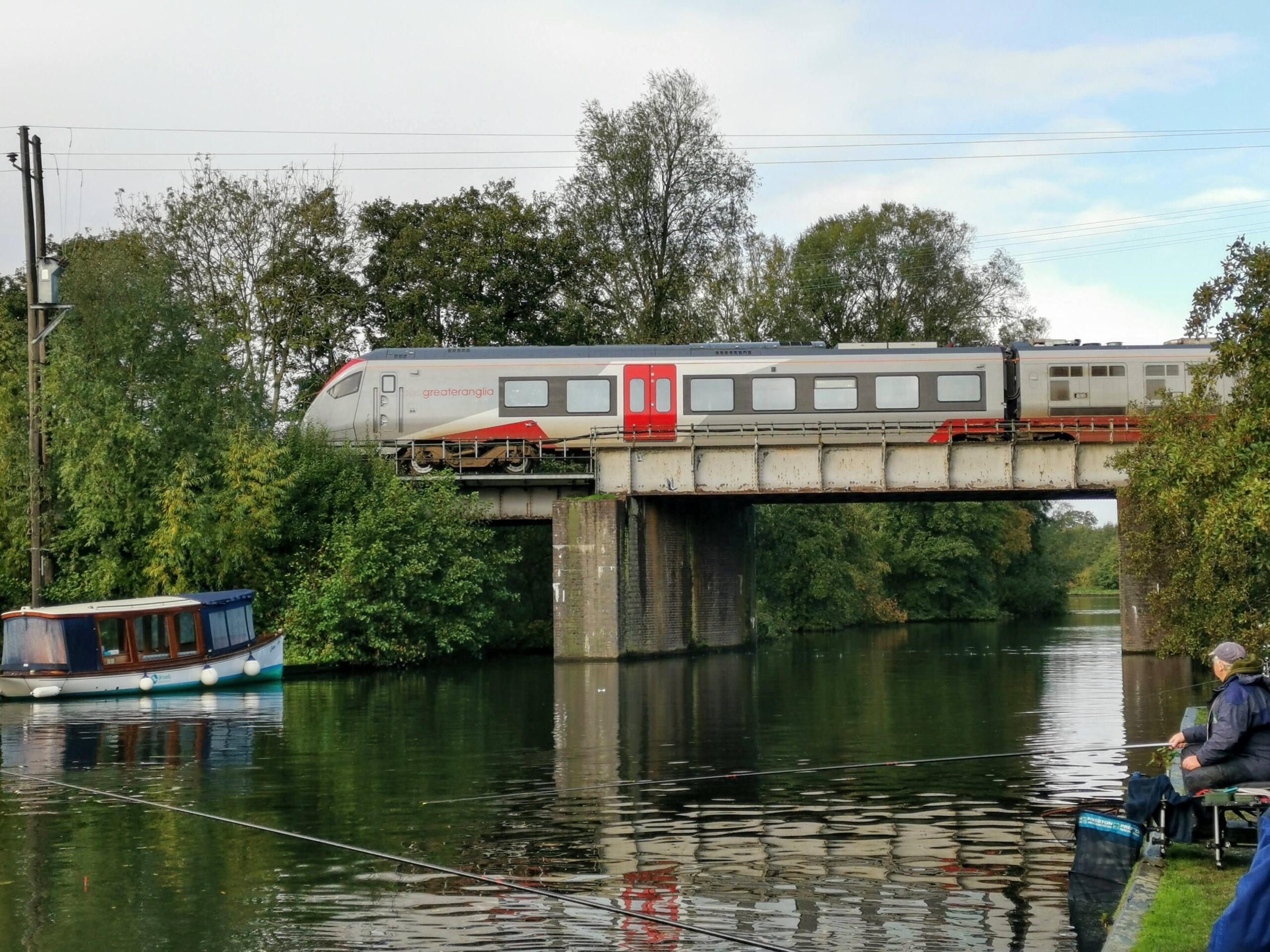 Greater Anglia train crossing the Bure at Wroxham Bittern Line