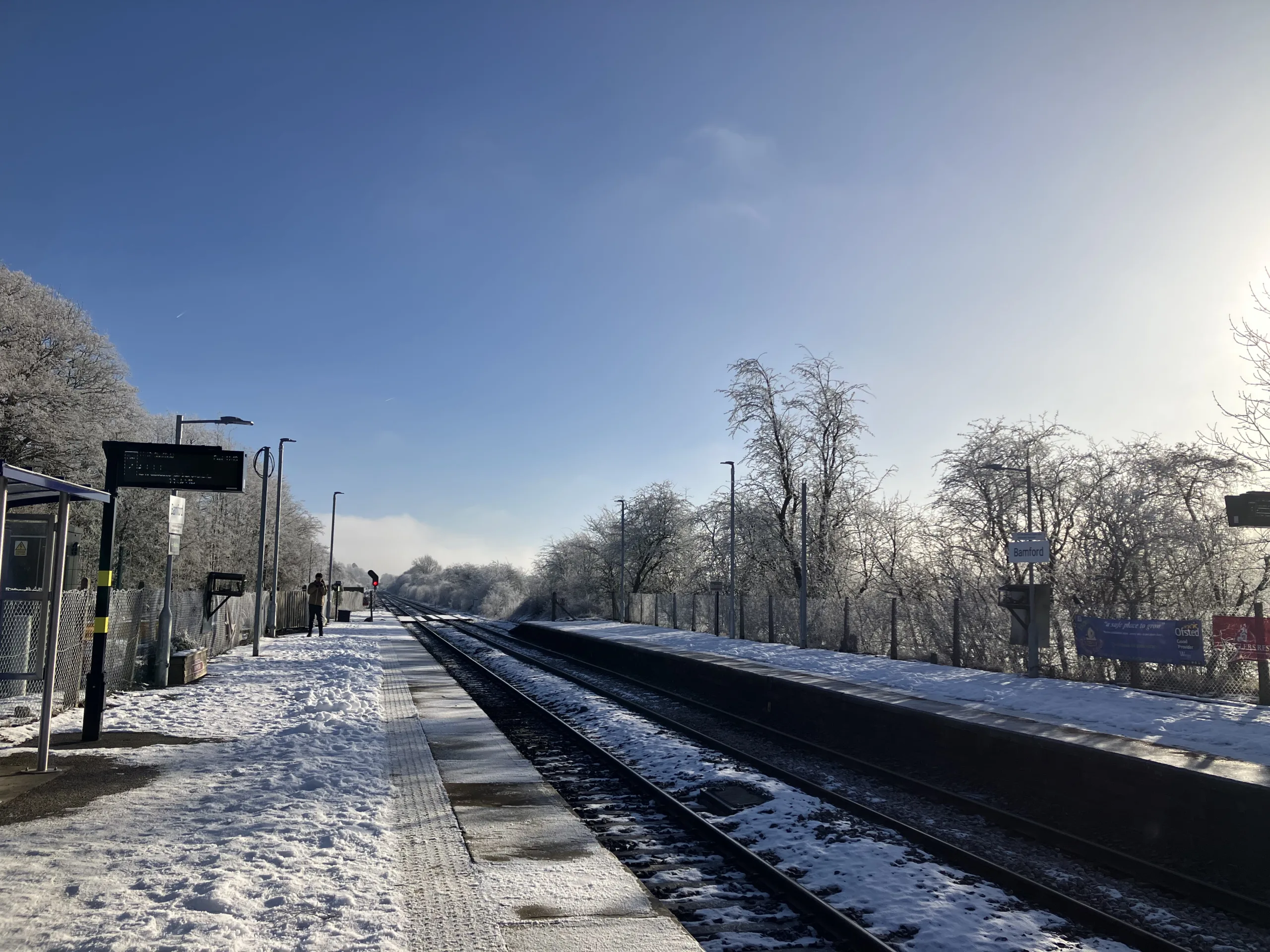 Bamford Station in the snow with blue sky.
