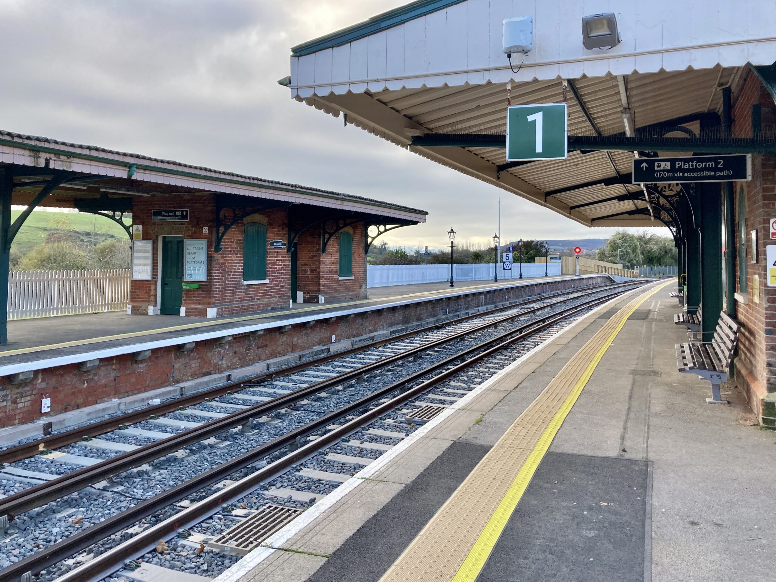 Train station platform with tracks