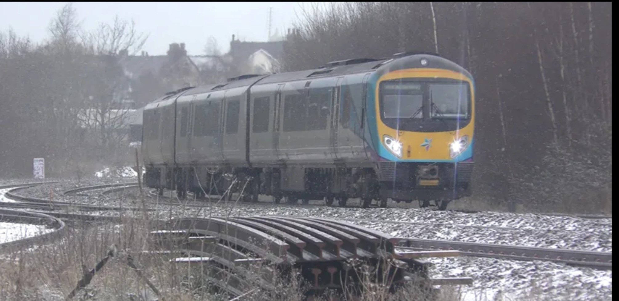 Scarborough to York TPE train travelling on snowy tracks