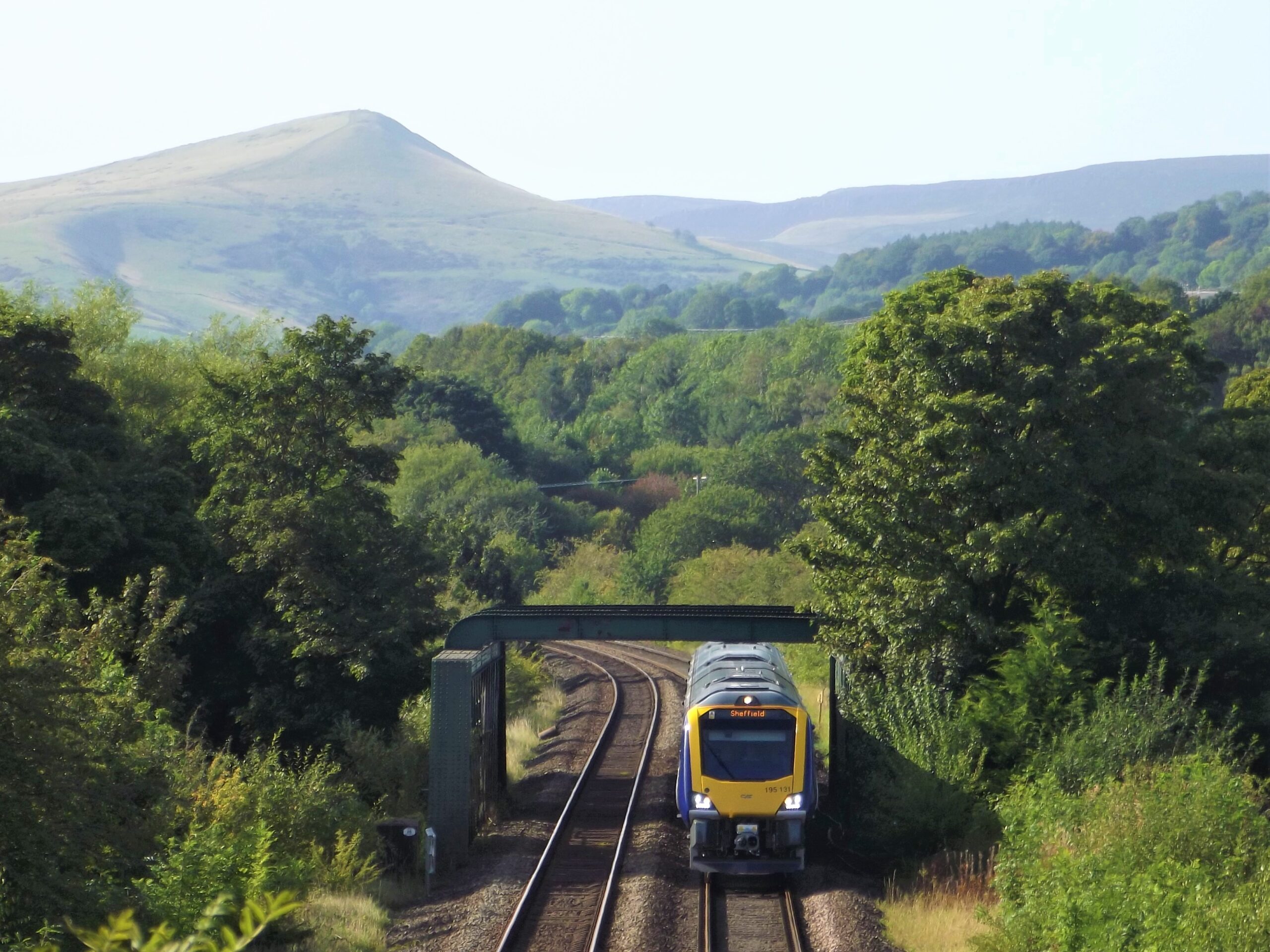 Train travelling through the stunning landscape of the Hope Valley Line