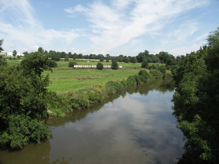 Train travelling through the countryside along the Medway Valley railway line. South East UK.