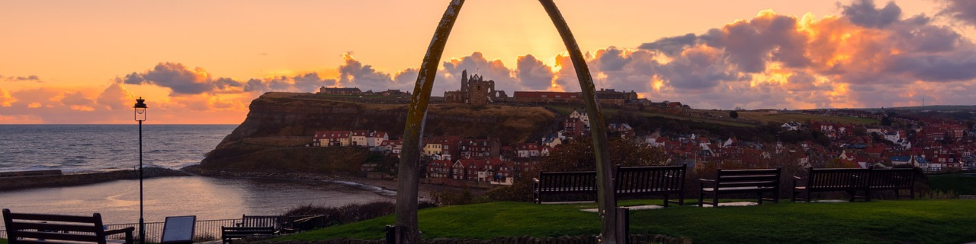 View of Whitby town, harbour and abbey from between the whale bones