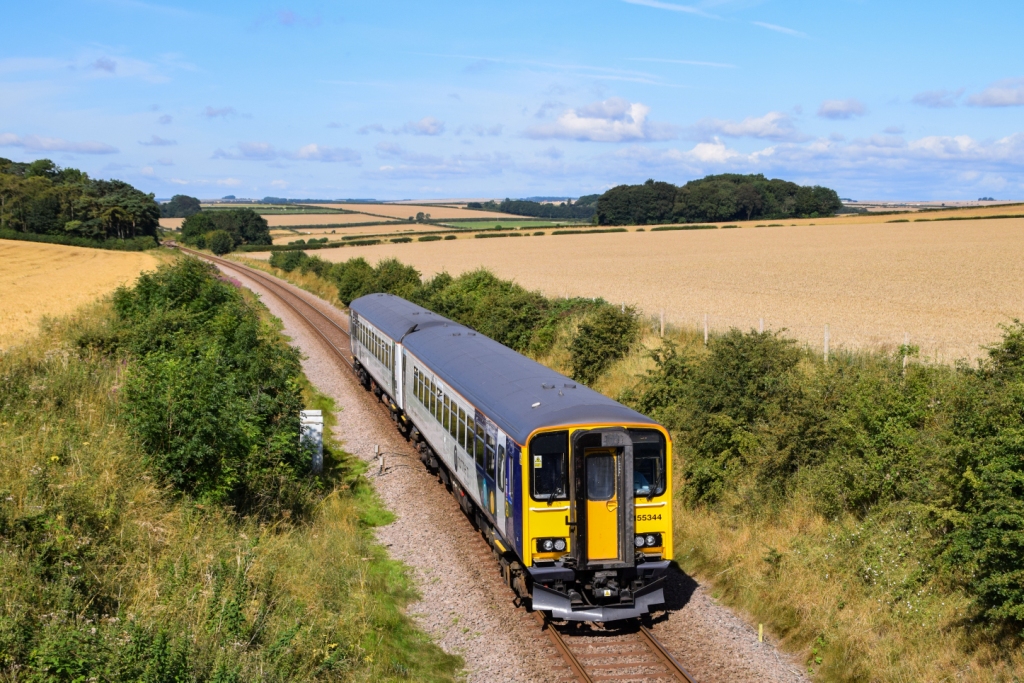 Train travelling through rolling Yorkshire countryside