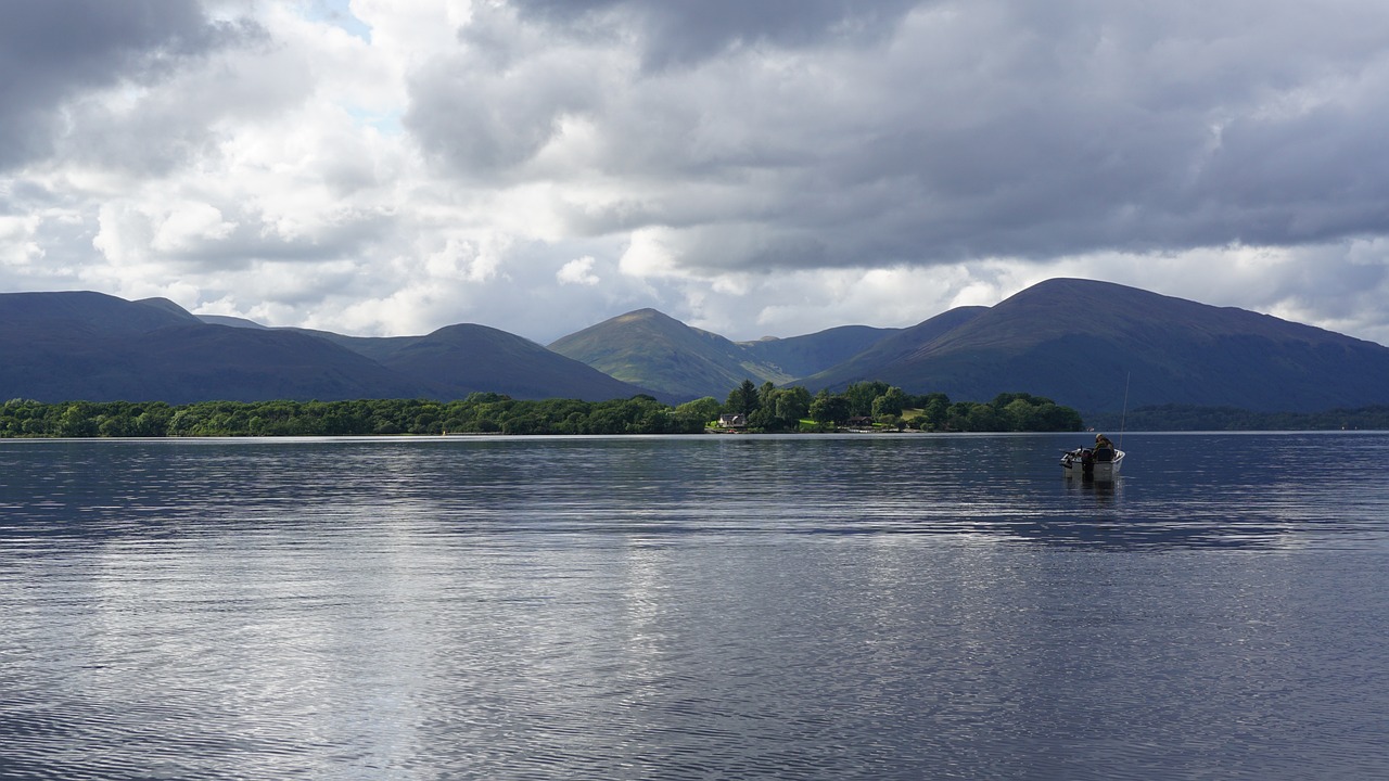 An image of a lake with mountains in the background