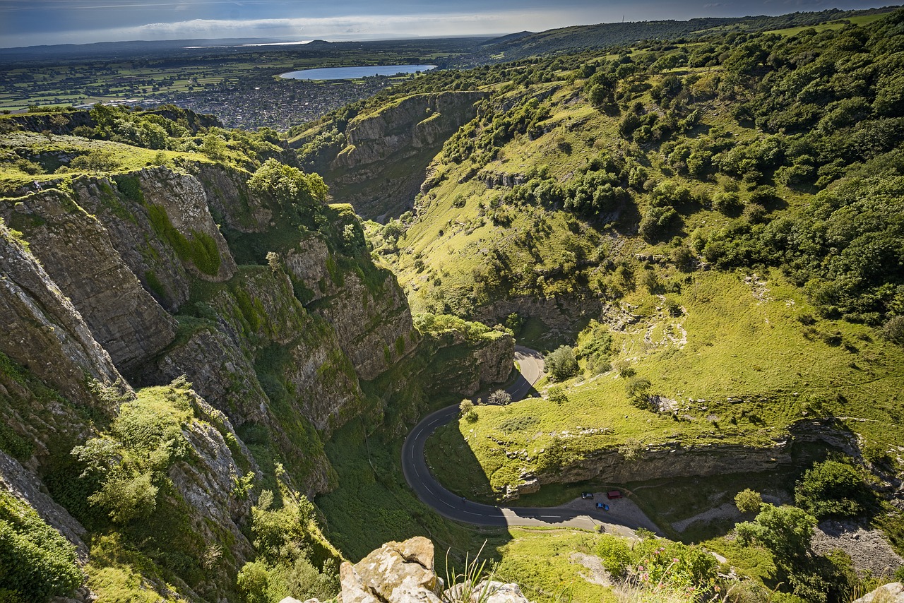 Cheddar Gorge - dramatic cliffs covered in lush green foliage