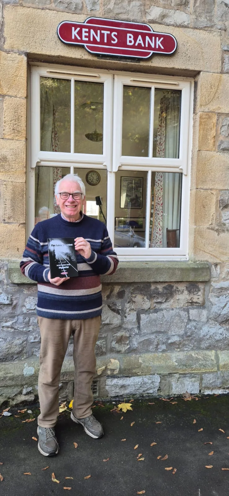 Person stood outside Kents Bank Station Library | Dr Paul Salveson part of the Halloween special blog