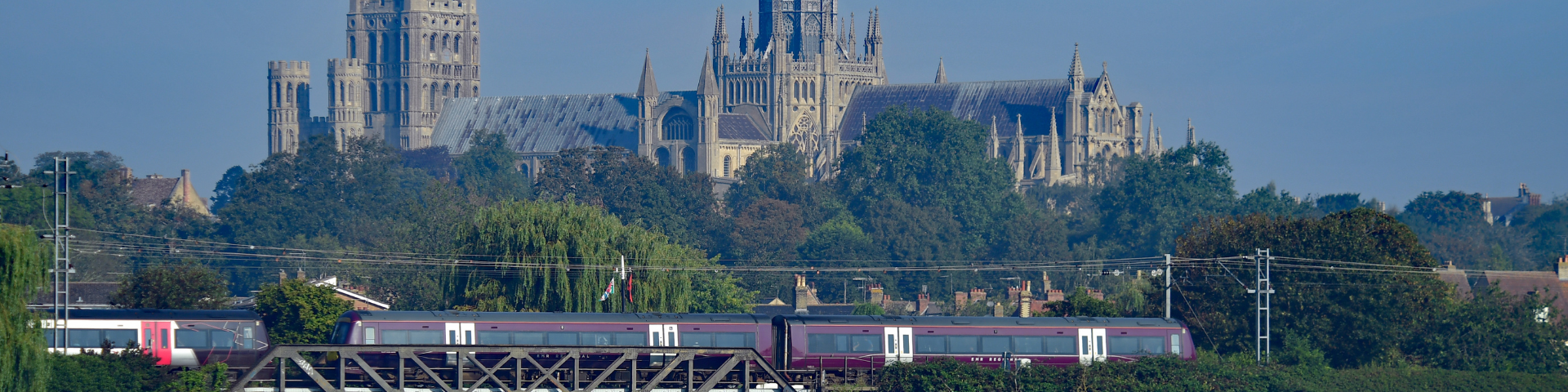 Train travelling in front of Ely Cathedral along the Hereward Line.